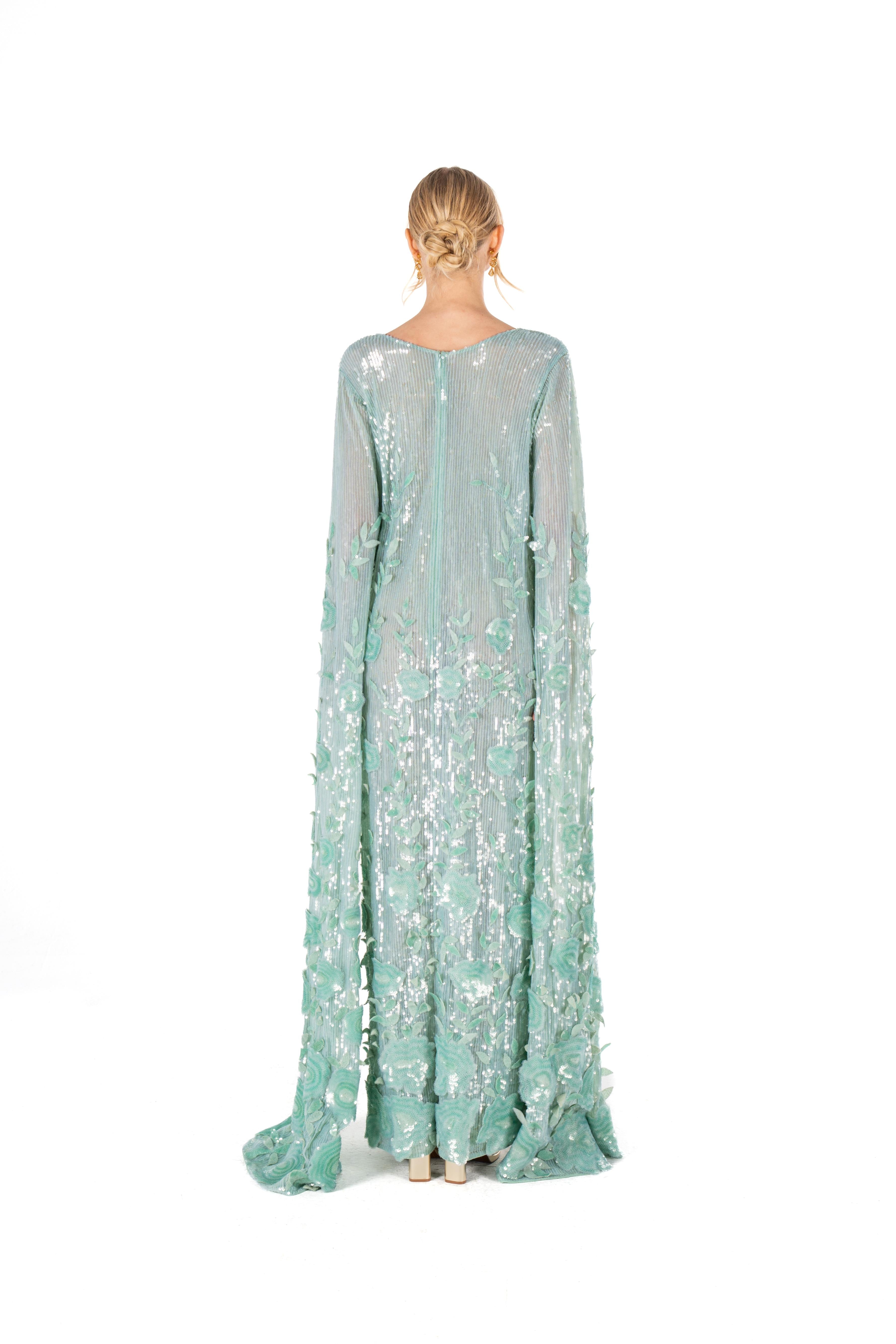 Model wearing a beautiful 3D Floral Embroidered Sequin Caftan, demonstrating the flowing silhouette and vibrant floral design.