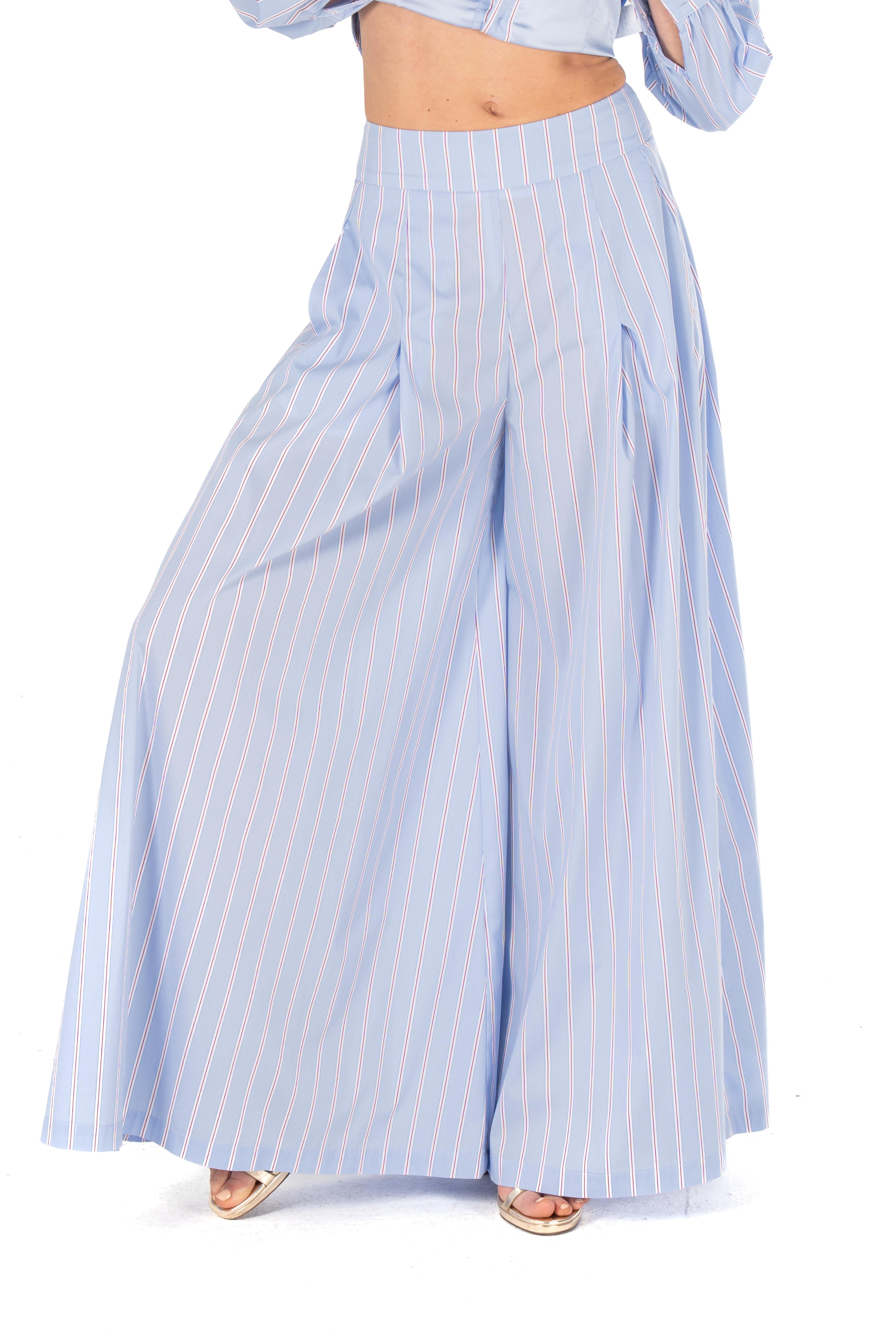 Light blue striped pants worn by a person on a white background