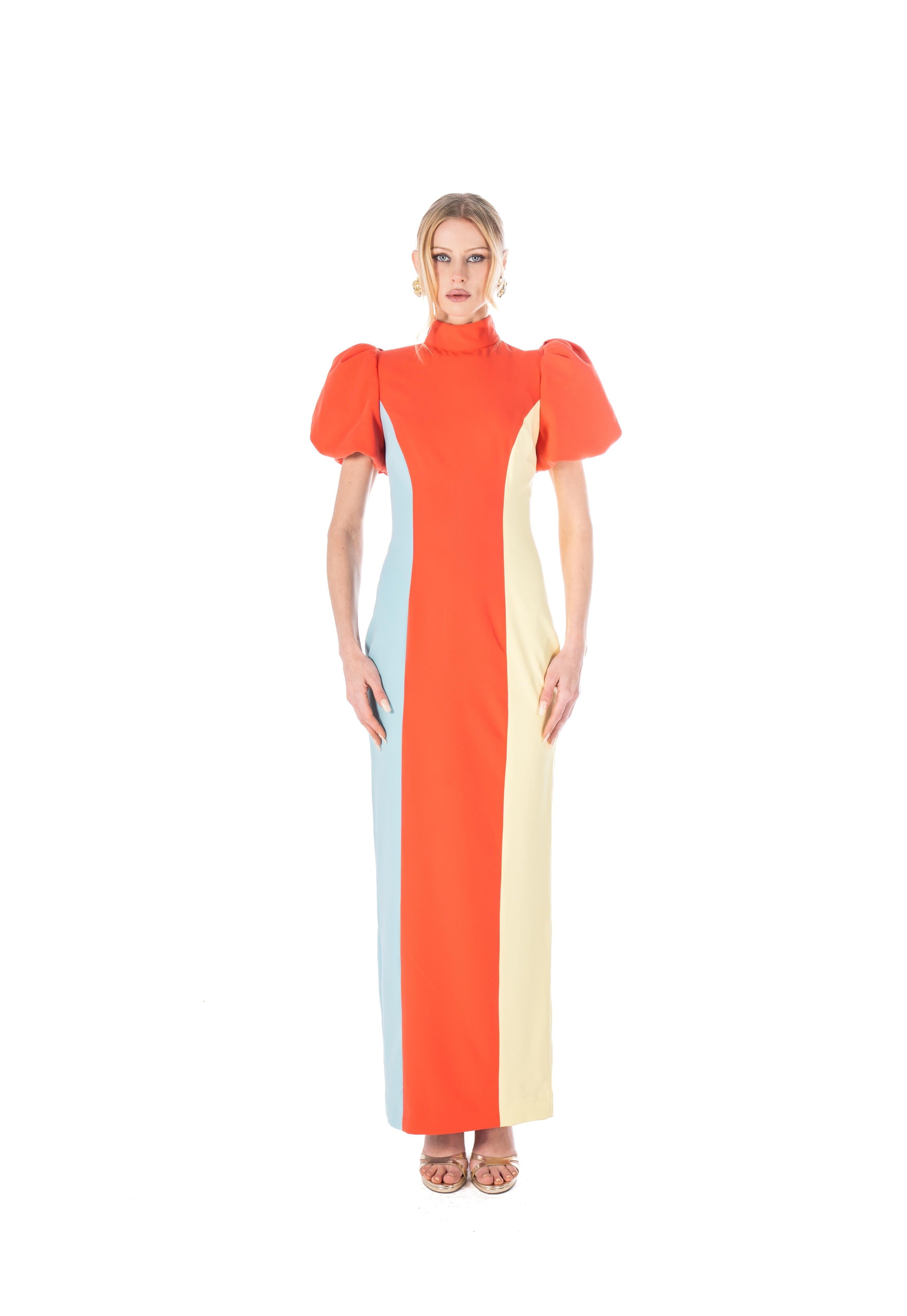 Woman wearing a colorful dress with a white background