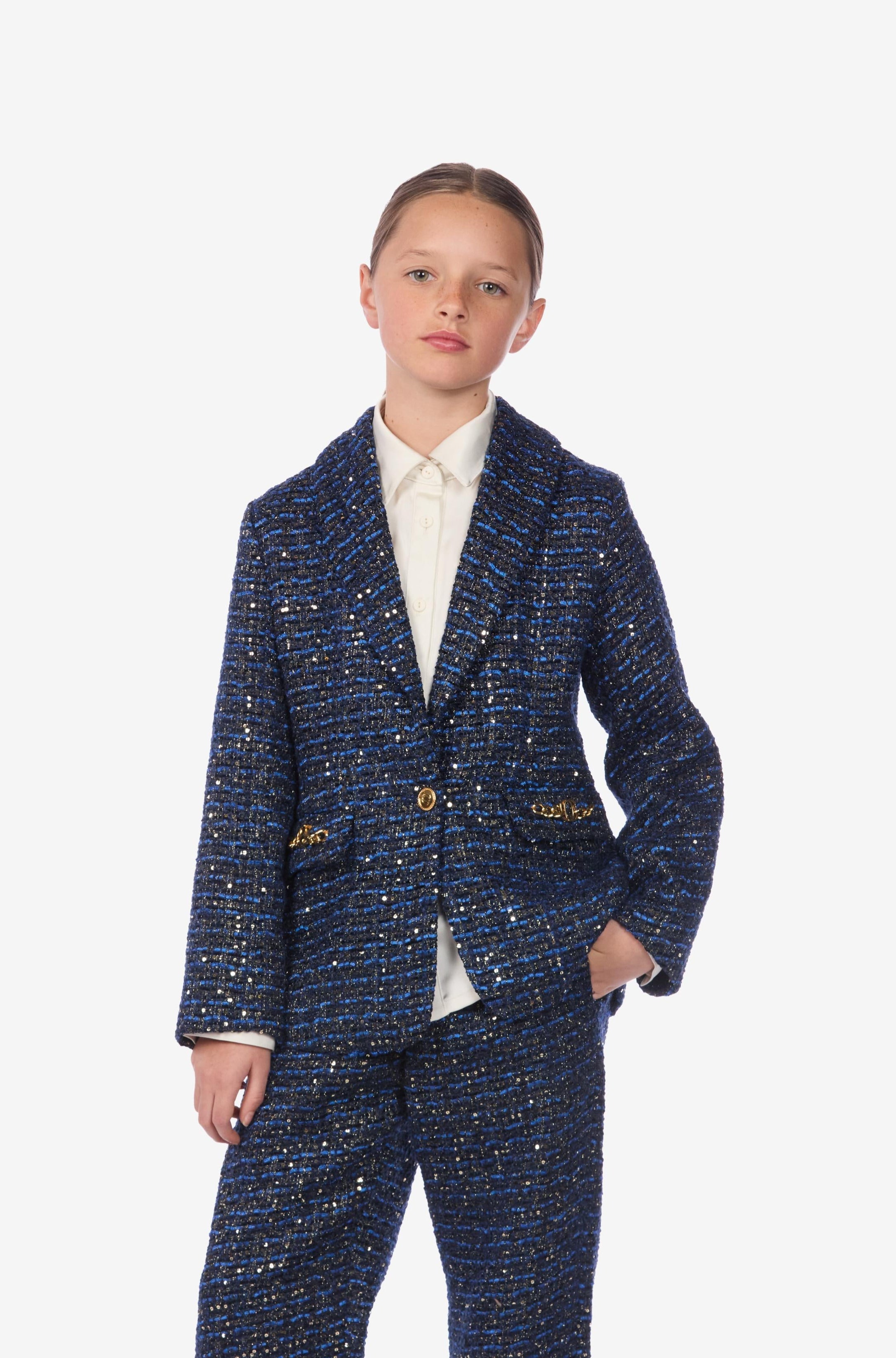 Person wearing a blue patterned suit on a white background