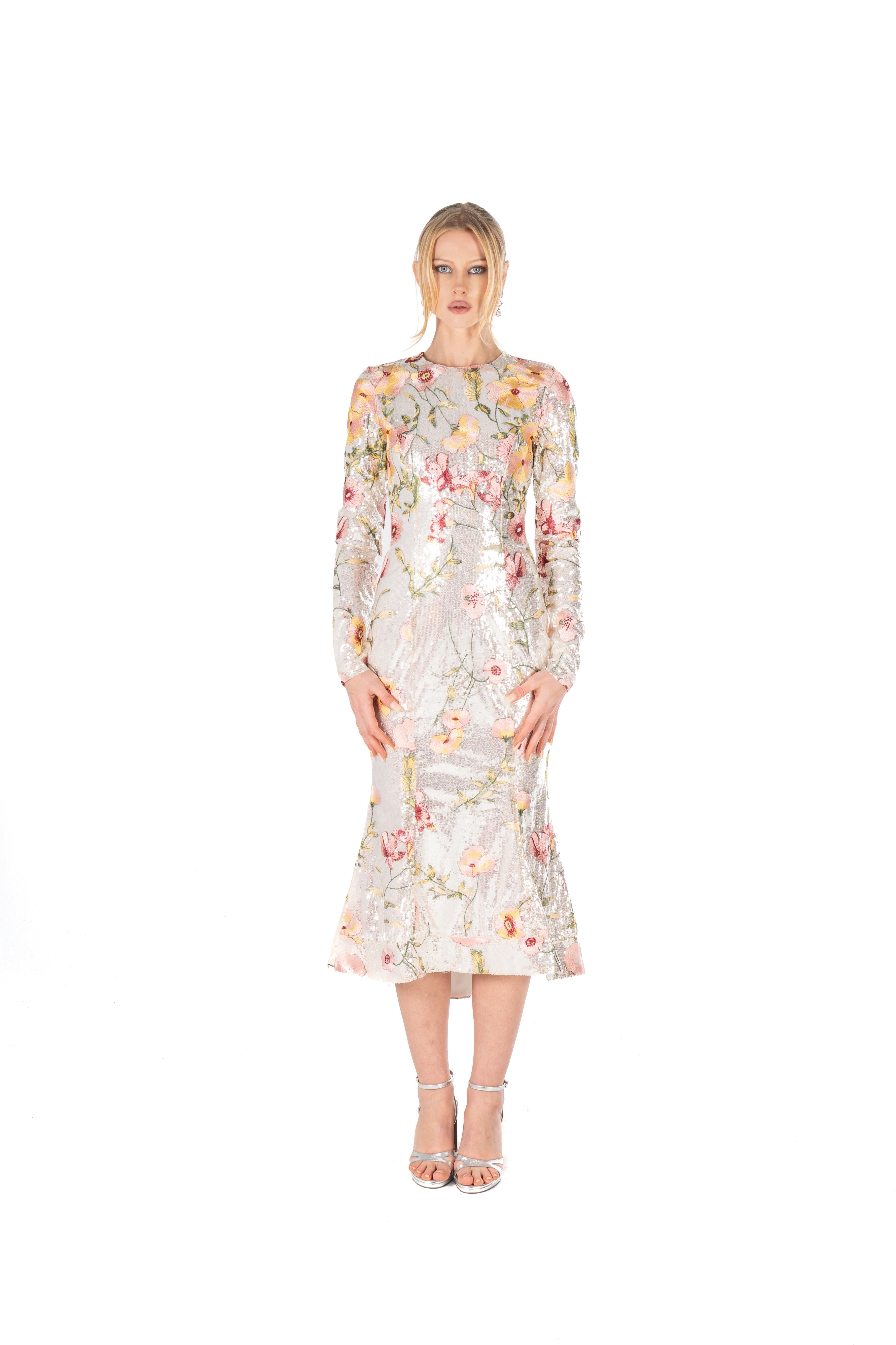 Woman wearing a floral dress on a white background